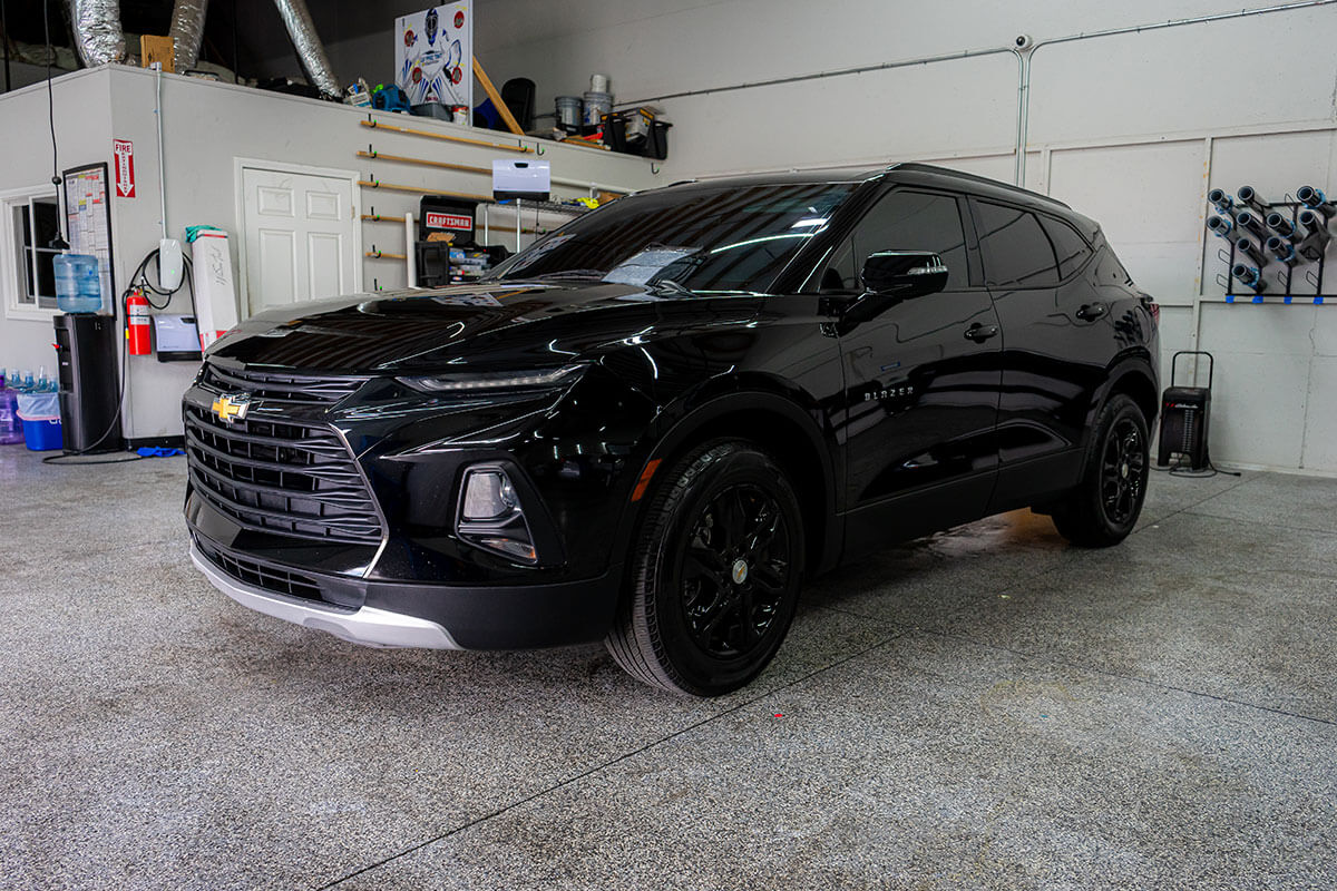 3M ceramic-coated SUV showing water beading hydrophobic effect after a Spring Valley wash