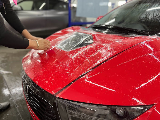 Satin finish PPF converting a glossy black vehicle to a matte finish while protecting the paint underneath in Spring Valley Ranch